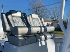 Close-up of stylish seating in a boat, showcasing modern design and comfort for passengers.
