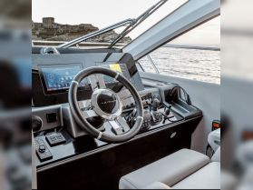 A sleek view of the helm and console of an Azimut yacht, showcasing modern navigation technology and luxurious design — perfect for navigating the open waters.