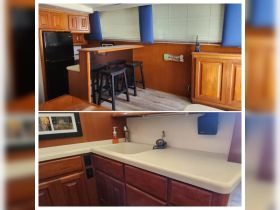 Interior view of a boat's kitchen area featuring a bar seating and a well-equipped countertop, perfect for onboard dining and relaxation.