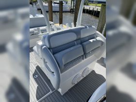 A close-up view of the luxurious seating area inside a boat, featuring modern design and comfortable upholstery, perfect for relaxing while cruising.