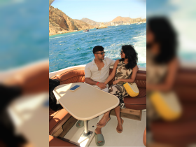 A couple enjoys a romantic moment aboard a boat, surrounded by stunning coastal views — perfect for intimate getaways or special celebrations on the water.