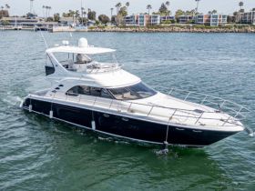 A sleek yacht cruising through calm waters, showcasing its elegant design and perfect for luxury outings.