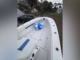 Interior view of a boat featuring comfortable seating and storage space, ideal for fishing trips or leisurely outings on the water.