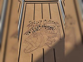 Close-up of the deck featuring the 'Bad Intentions Fishing Charters' logo, showcasing fishing gear and a detailed fish illustration — perfect for fishing enthusiasts.