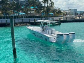 A sleek speedboat named 'Avanti' glides through crystal-clear waters, showcasing its powerful engines and stylish design — perfect for thrilling adventures on the water.