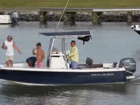 A lively group enjoys a day on the water aboard a Sea Hunt boat, showcasing the fun and camaraderie of boating adventures.