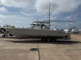 A sleek Contender boat displayed on a trailer, showcasing its impressive design and features, perfect for fishing and water sports.