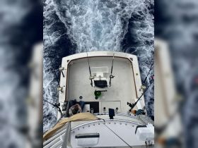 An overhead view of the interior of a fishing boat, showcasing the helm and seating area, perfect for anglers looking to enjoy a day on the water.