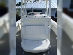 A clean and spacious helm seating area on a boat, showcasing the comfortable design ideal for a day on the water.