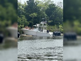A lively group enjoys a day on the water aboard a fishing boat, perfect for celebrations and group outings.