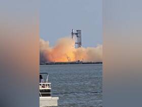 A stunning view of a rocket launch from the water, with a boat in the foreground, capturing the excitement of space exploration against a dramatic backdrop.