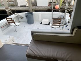 Interior view of a boat showcasing seating and helm area, ideal for fishing or cruising adventures.