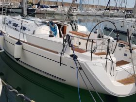 A sleek yacht docked at the marina, showcasing its elegant design and features, perfect for sailing enthusiasts.