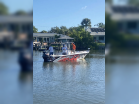 A group of anglers prepares for a fishing adventure on a sleek boat, showcasing the excitement of a day on the water.