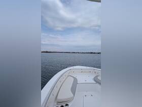 A view of the comfortable seating area inside a boat, perfect for relaxing while enjoying the water. Ideal for day trips or leisurely cruises.