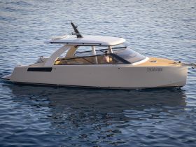 A sleek yacht glides through calm waters, showcasing its modern design and elegance — perfect for luxury outings on the sea.