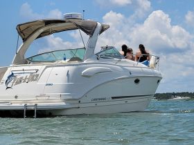 A group of friends enjoys a sunny day on the water aboard a stylish boat, perfect for summer relaxation and fun.