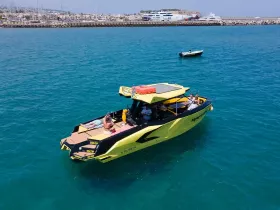 A vibrant yellow boat with guests enjoying the sun and water, perfect for a fun day out on the ocean.