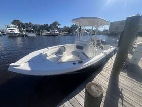 A sleek speedboat docked at a marina, showcasing its modern design and ready for a day on the water.