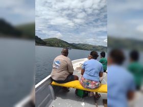 A group of friends enjoys a scenic boat ride, taking in the beautiful landscape and calm waters — perfect for exploring nature and creating lasting memories.