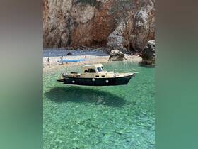A charming boat anchored in crystal-clear turquoise waters, with a scenic beach and rocky cliffs in the background, perfect for a relaxing day on the water.