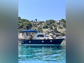 A charming boat anchored in clear waters, surrounded by rocky terrain, showcasing a perfect day for boating adventures.