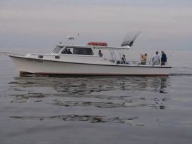 A group of fishermen aboard a boat, enjoying a day on the water — perfect for fishing adventures and camaraderie.