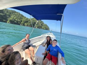 A joyful family enjoys their time aboard a boat, surrounded by stunning ocean views — perfect for creating unforgettable memories on the water.