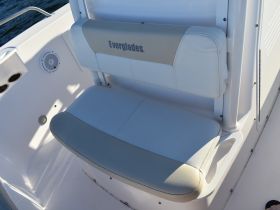 A close-up view of a comfortable seating area in a boat, showcasing the sleek design and quality materials, perfect for relaxing while on the water.