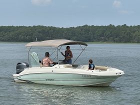 A family enjoys a day on the water aboard a Stingray boat, creating lasting memories in a scenic setting.