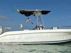 A sleek speedboat captured in clear waters, showcasing its design and features, perfect for thrilling water adventures.