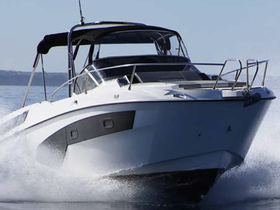 A sleek speedboat cuts through the water, showcasing its dynamic design and performance. Perfect for thrilling water adventures.