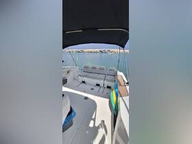 A spacious interior view of a boat's seating area, showcasing comfortable lounge space ideal for relaxation while cruising.