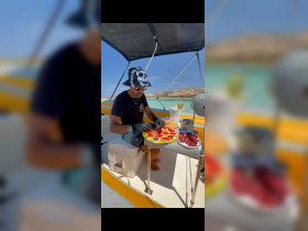 A chef prepares a delicious spread of snacks on a boat, showcasing the perfect catering setup for a day on the water.