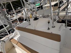 A clean and spacious interior view of a boat's helm and seating area, perfect for comfortable cruising and relaxation.