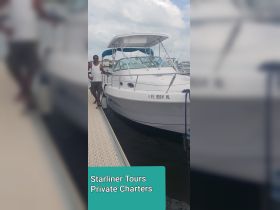 A man stands beside a charter boat named 'Starliner Tours' at the dock, showcasing the vessel's sleek design and readiness for private charters.