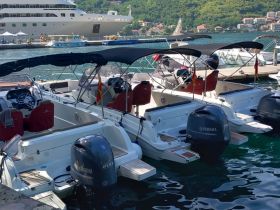 A collection of speedboats docked at a marina, showcasing their sleek designs and Yamaha engines, perfect for exploring coastal waters.