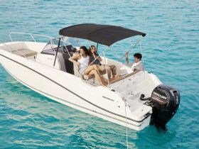 A group enjoys a relaxing day on a boat, showcasing the perfect setting for fun and adventure on the water.