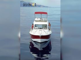 A family enjoys time aboard a boat on calm ocean waters, showcasing a perfect day for relaxation and adventure.