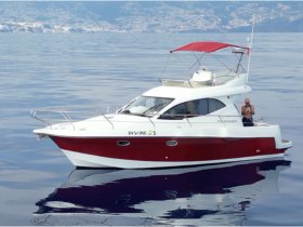 A stunning yacht named 'DIVINE 1' glides through calm waters, showcasing a relaxed atmosphere with a guest enjoying the view — perfect for luxury boating experiences.