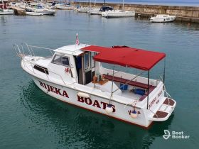 A well-maintained boat named 'Rijeka Boats' docked in calm waters, showcasing its structure and design — perfect for exploring coastal destinations.