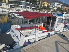 A well-maintained boat named 'Nika' docked at the marina, showcasing its inviting seating and safety equipment — perfect for exploring the beautiful coastline.