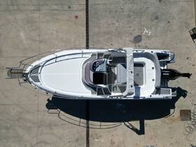 Aerial view of a sleek boat docked, showcasing its design and structure — perfect for those looking to charter or purchase a vessel.