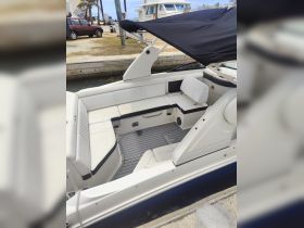 A stylish interior view of a boat's seating area, showcasing comfortable lounge space and modern design, perfect for relaxing on the water.