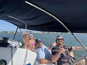 A fun group of friends enjoys a sunny day on the water, capturing the essence of a perfect boating adventure.