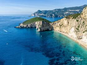 A stunning aerial view of a picturesque coastline featuring turquoise waters and lush greenery, perfect for showcasing beautiful beach destinations.