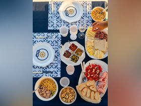 A beautifully arranged spread of snacks and drinks on a boat, perfect for enjoying a relaxing day on the water with friends or family.