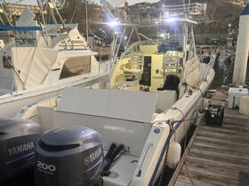 A well-equipped boat docked at the marina, showcasing its sleek design and powerful Yamaha engines, perfect for fishing or leisure outings.
