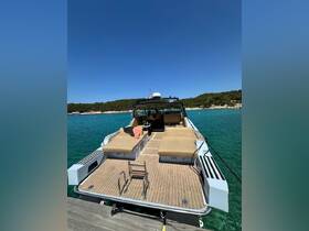 The interior of a luxurious boat featuring spacious lounge seating, perfect for relaxing on the water. Ideal for day trips or sunset cruises.
