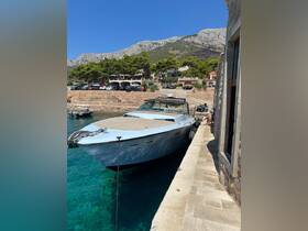 A sleek speedboat docked at a picturesque harbor, surrounded by clear turquoise waters and scenic hills, perfect for summer adventures.